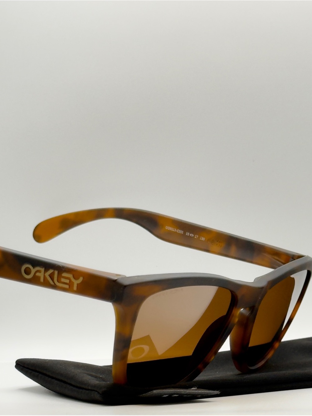 Oakley Tortoiseshell Frame Sunglasses with Brown Lenses